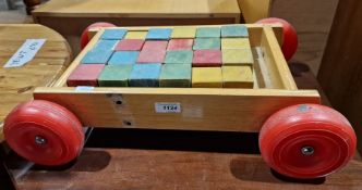 Set of children's painted building bricks in stained wood stand with wheels