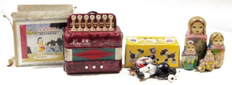 Pelham puppet 'Cat', in original box, a toy accordion and a Russian matryoshka doll (3)