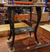 Carved oak occasional table, rectangular, allover sunflower decorated with undershelf, on scroll