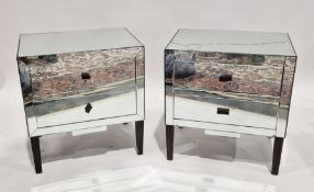 Pair of mirrored bedside chests of drawers, each having two drawers, on tapered legs, 64cm high x