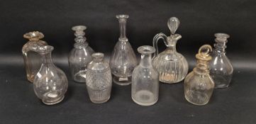 Group of nine decanters and carafes, early 19th century and later, including: a notch cut carafe,