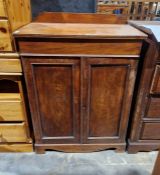 Victorian mahogany cabinet having one drawer raised above a two door cupboard, the cupboard