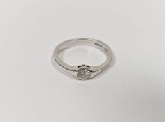 18ct white gold and diamond ring, the brilliant cut diamond set in rubover shoulders, diamond