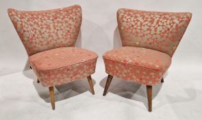 Pair of pink upholstered chairs raised on turned tapered legs, 71cm high approx.