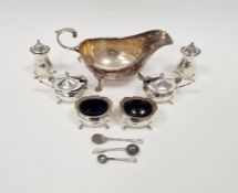 Silver six-piece condiment set, baluster-shaped and each piece raised on four tab feet and a