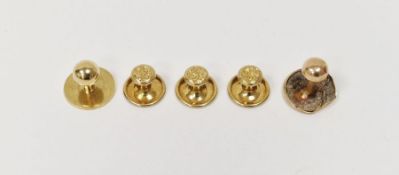 Three 18ct gold studs with engraved circular terminals and another 18ct gold stud with ball