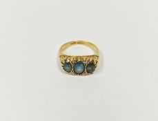 18ct gold, blue stone and diamond dress ring set three pale blue oval cut stones interspersed by