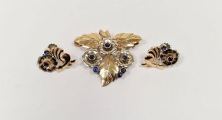 9ct gold and sapphire floral foliate spray brooch having three flowers all over set with six