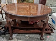Mahogany extending dining table, circular, on foliate and shell carved turned supports, claw and