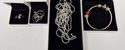 Five rings, probably Pandora, in Pandora box, a Pandora 'Pudsey' charm, a bangle bracelet, other