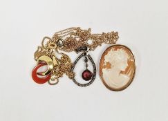 9ct gold and cornelian-coloured stone double-scroll pendant on fine 9ct gold curb link chain,