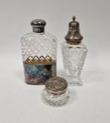 Cut glass hip flask with silver-plated cup and lid, a silver-mounted cut glass sugar caster and a