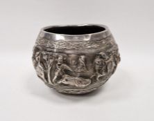 Indian white metal bowl decorated with continuing repousse scene, showing a game hunt, animals