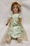 Large Alt Beck bisque head doll, early 20th century, AB mark/1362/5, with jointed composition