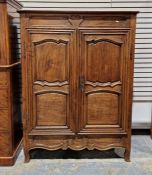 French fruitwood armoire enclosed by two shaped panel doors enclosing shelves, 157cm high x 120cm