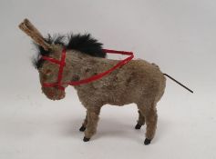 Clockwork wind-up donkey with moving tail and ears