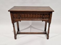Reproduction oak side table fitted a frieze drawer with null carved front and turned knob handles,