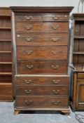 Georgian oak chest on chest secretaire, the top section having two short over four long drawers, the