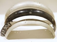 Three vintage aluminium motor cycle mudguards, one fixed with a number plate FXY904, smaller in
