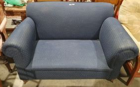 Early 20th century 2 seater sofa in blue trellis weave on tapering supports and castors.