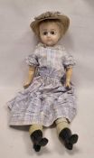 Wax shoulderhead doll with fixed blue glass eyes, closed mouth, cloth body and composition lower