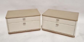 Pair of Loddenkemper Raum design cream bedside chests of drawers, each with two drawers, each 38cm