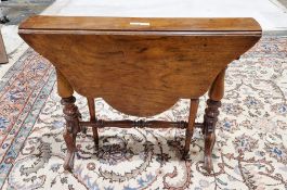 Victorian walnut sutherland table having shaped fall flaps, on turned supports and stretcher, 88cm x