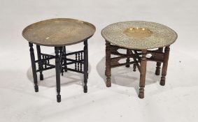 Two Eastern carved wood brass topped occasional tables (2)