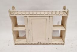 Cream painted Edwardian wall cabinet with turned spindle gallery, the central cupboard flanked by