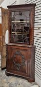 Edwardian mahogany standing corner cupboard, the upper section having egg and dart moulded