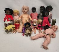 Collection of mid-century dolls, including: a German composition doll, a Roddy black doll, various