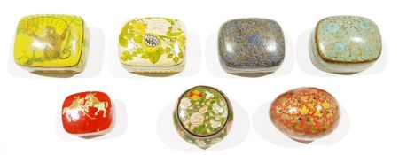 Seven Indian papiermache boxes, including an example with polo players, others with flowers,
