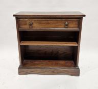 Jaycee mid 20th century reproduction oak bookcase fitted a drawer over two shelves, on bracket feet,