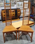 Set of four pine high ladder backed dining chairs on tapering supports.