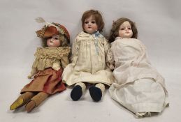 Three early 20th century dolls, comprising: an Armand Marseille (German) bisque headed doll,