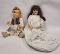 Large Schoenau & Hoffmeister bisque head doll and a celluloid doll, early-mid 20th century, the