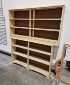 Two cream painted open bookshelves, 90cm high x 161cm wide x 24cm deep and 98cm high x 144cm wide