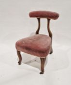 Victorian walnut framed bedroom chair with a pad bar back and on moulded cabriole supports, with