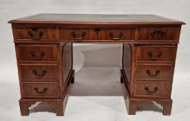 Modern yew veneered kneehole pedestal desk having green tooled leather inset top, each pedestal