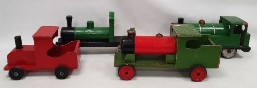 Four painted wooden locomotives to include a Green and black, a Nicoltoys green and red