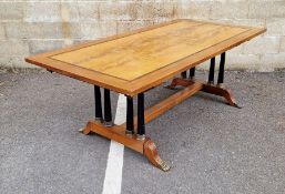 Empire-style mahogany inlaid and banded draw-leaf dining table, raised on two rows of four