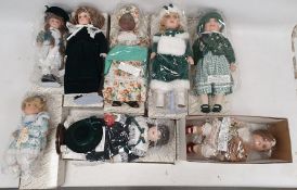 Twelve boxed Alberon Dolls, each bisque headed doll, dressed, holding toy, musical instrument,