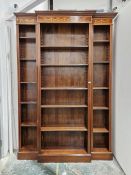 Edwardian Sheraton-style breakfront line inlaid mahogany bookcase having moulded dentil cornice over