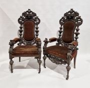 Pair of mid 19th century carved oak chairs having carved female masks to crest rail, pierced