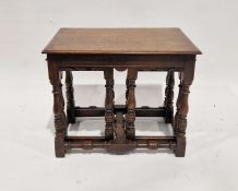 Nest of three oak tables on baluster turned supports and stretchers, largest 51cm high x 61cm wide x