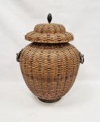 Covered basket, the cover with pointed metal finial and having iron ring handles, 67cm high overall