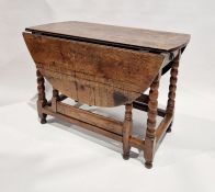 Antique oak gateleg table with bobbin turned supports, fitted end drawer, the oval top, 73cm high