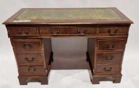Twin pedestal reproduction mahogany veneer desk with gilt tooled leather top, 77cm high x 124cm wide