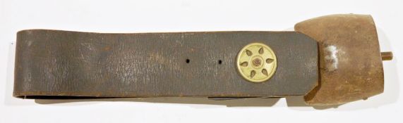 Vintage leather and brass-mounted cow bell with studded leather collar and foliate roundel mount,