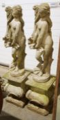 Pair of composite stone garden statues of classical female form, possibly Aphrodite, on shaped